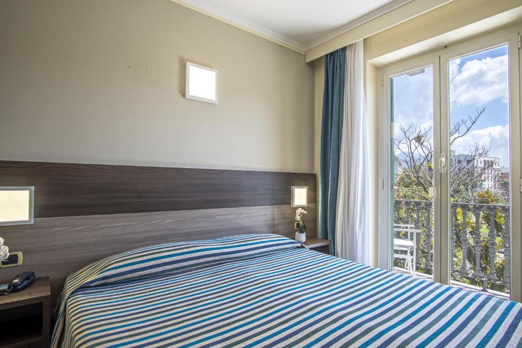 Кровать или кровати в номере Grande Albergo
