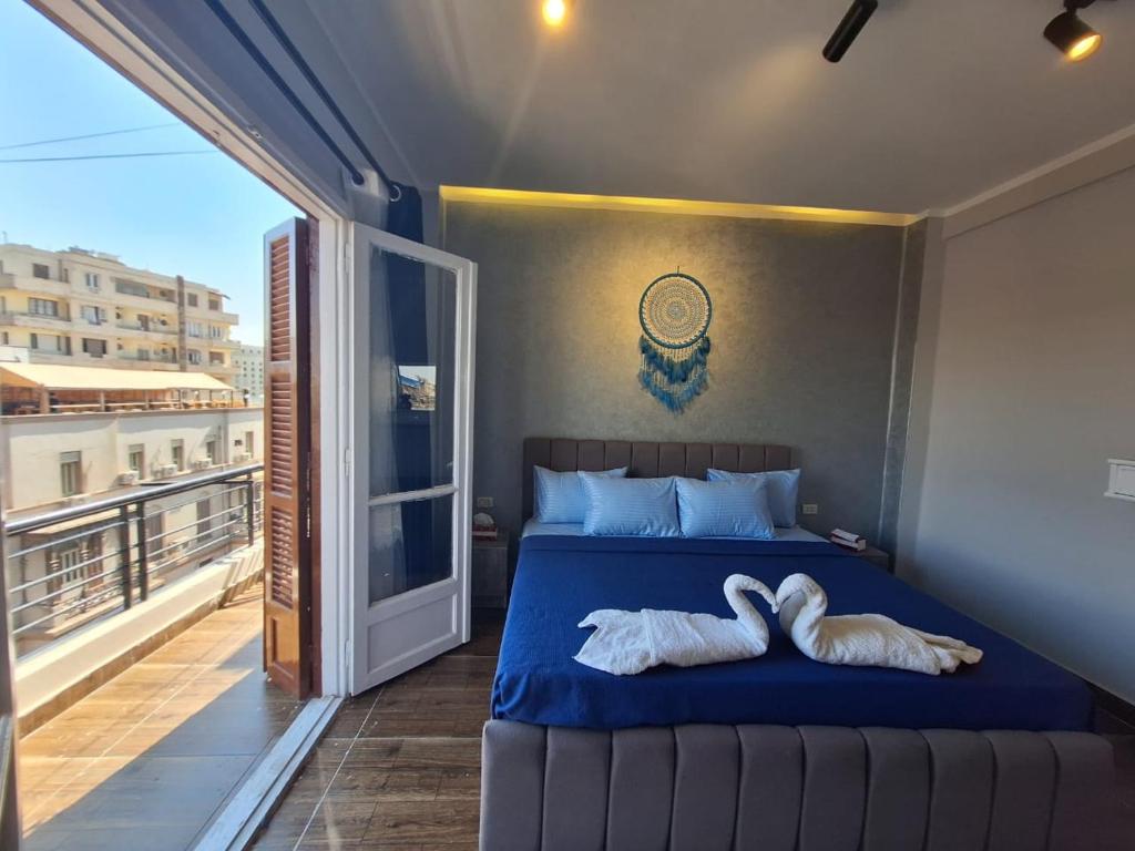 Postel nebo postele na pokoji v ubytování downtown Family Suites