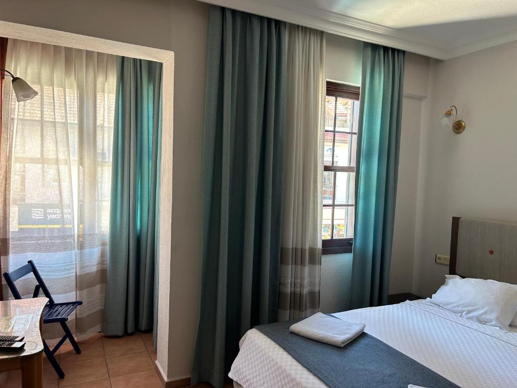Postel nebo postele na pokoji v ubytování Villa Danlin Hotel