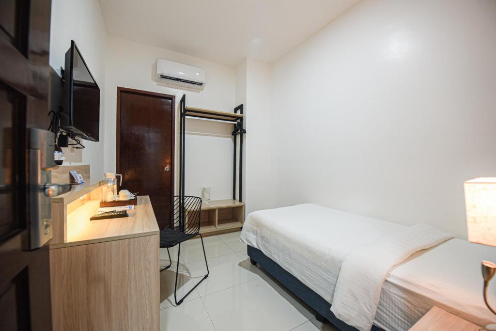 Postel nebo postele na pokoji v ubytování Figtree Hotel