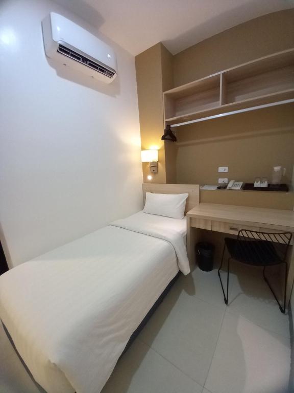 Postel nebo postele na pokoji v ubytování Figtree Hotel