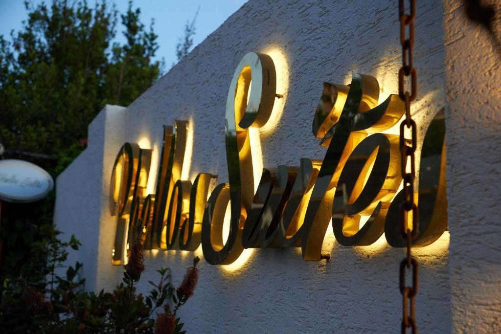 a sign on a building that says the word hotel at Phellos Suites Boutique Hotel in Şile