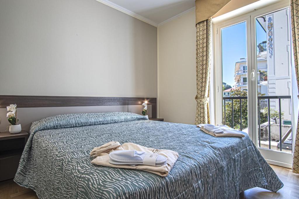 Кровать или кровати в номере Grande Albergo