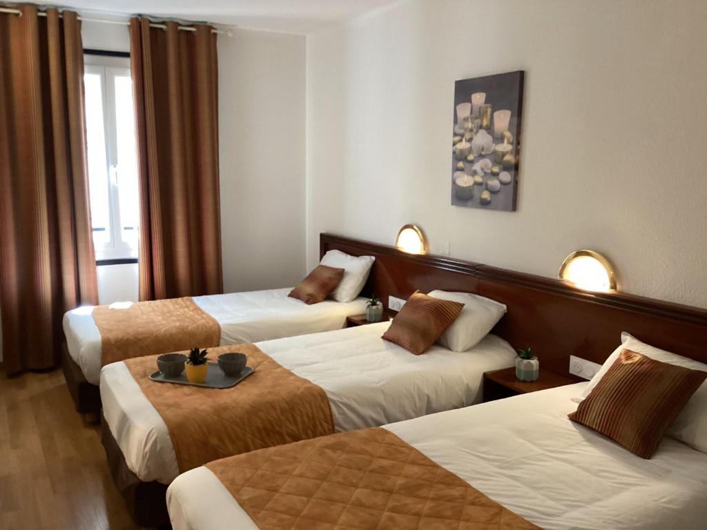 Postel nebo postele na pokoji v ubytování Hôtel Angelic