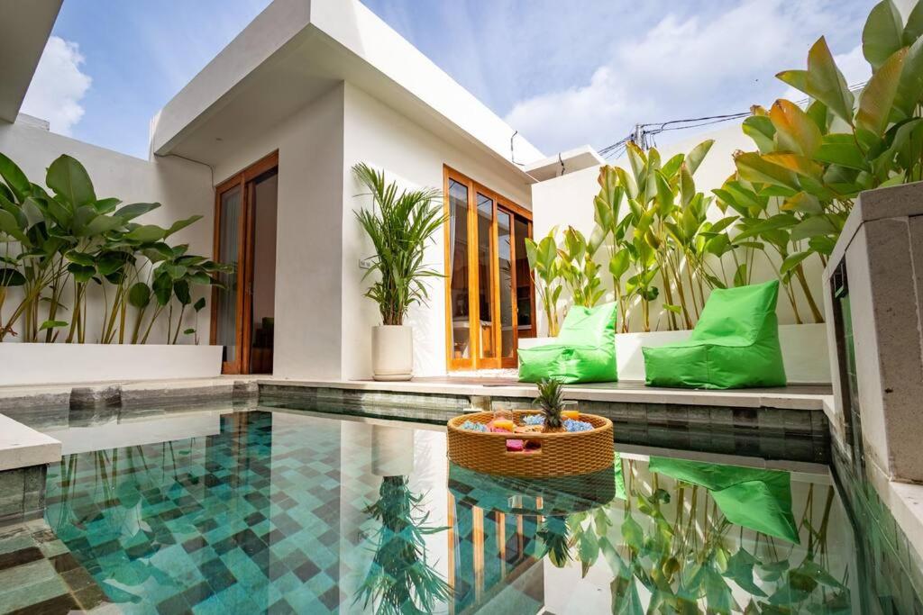a villa with a swimming pool and a house at Dive into Bliss - Brand New Seminyak Villa with Private Pool in Seminyak