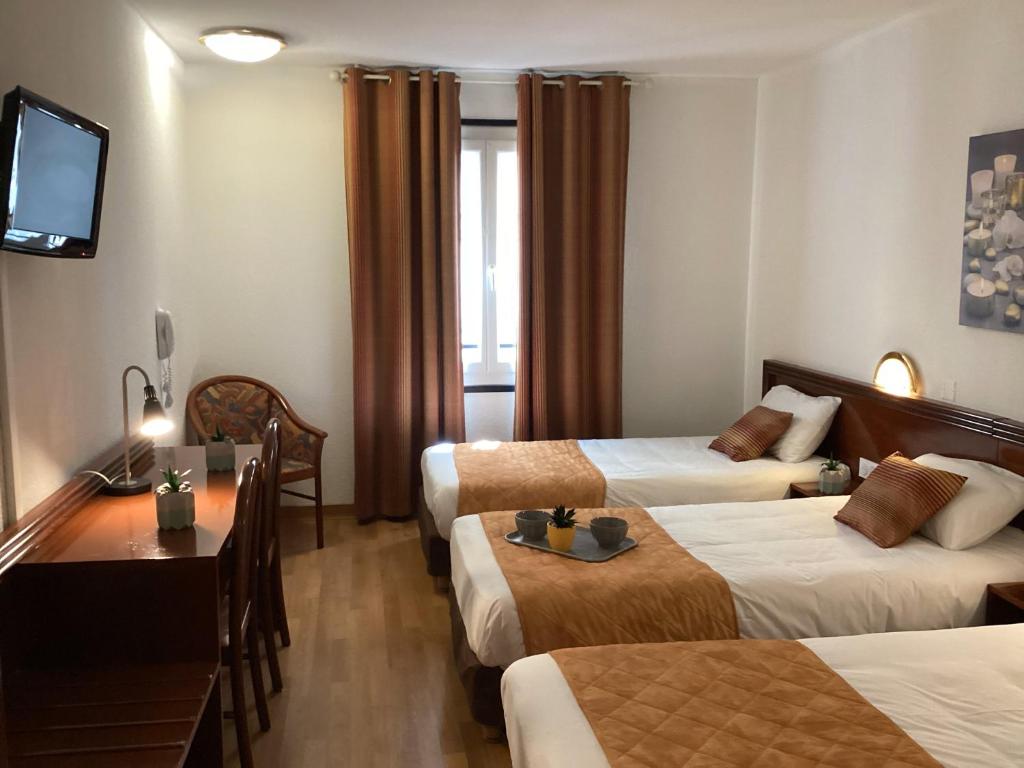 Postel nebo postele na pokoji v ubytování Hôtel Angelic