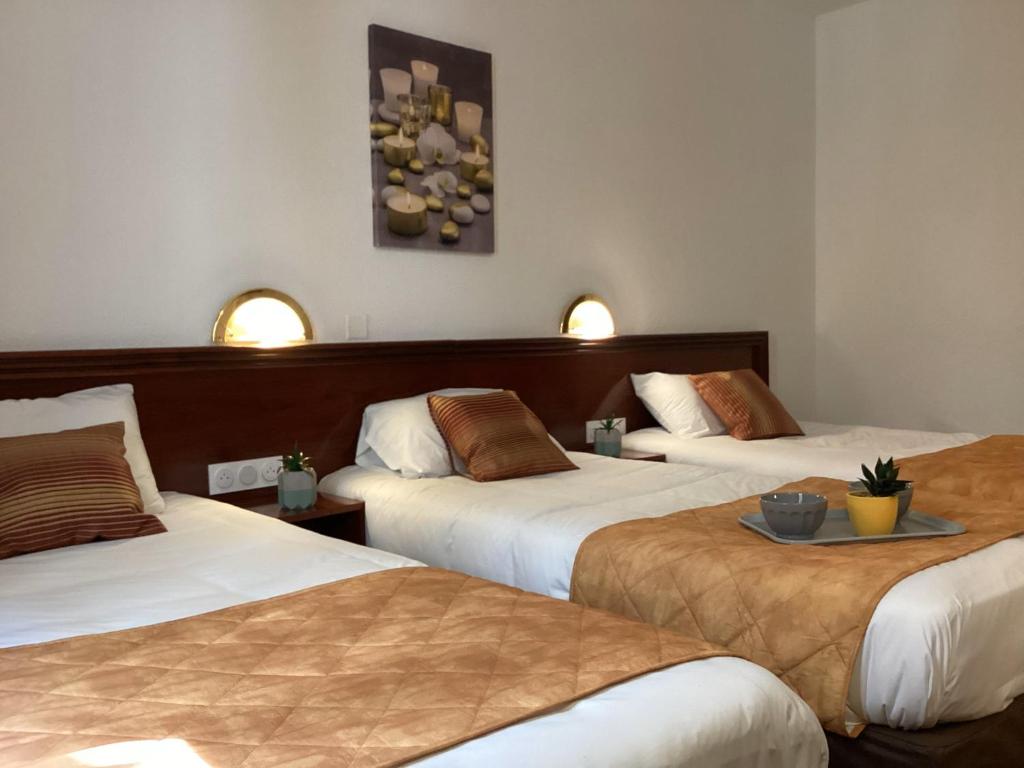 Postel nebo postele na pokoji v ubytování Hôtel Angelic