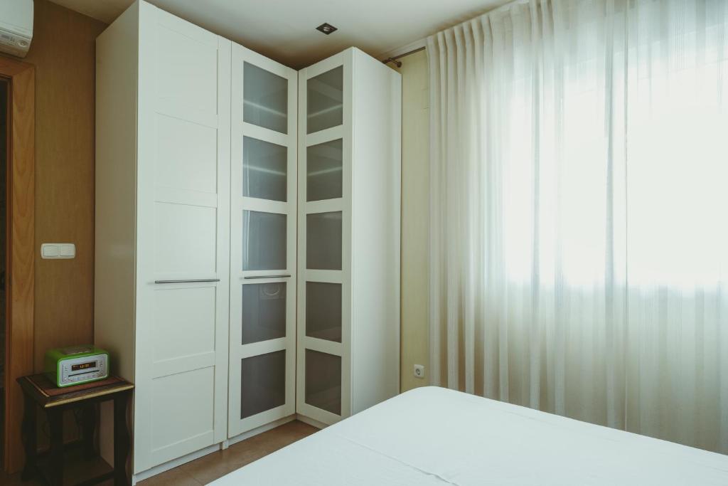 A bed or beds in a room at El Gran Azul - Altea