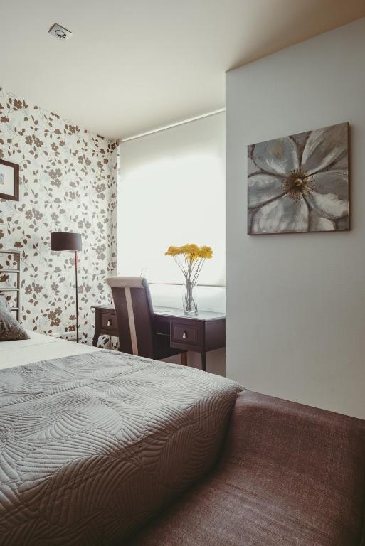 A bed or beds in a room at El Gran Azul - Altea