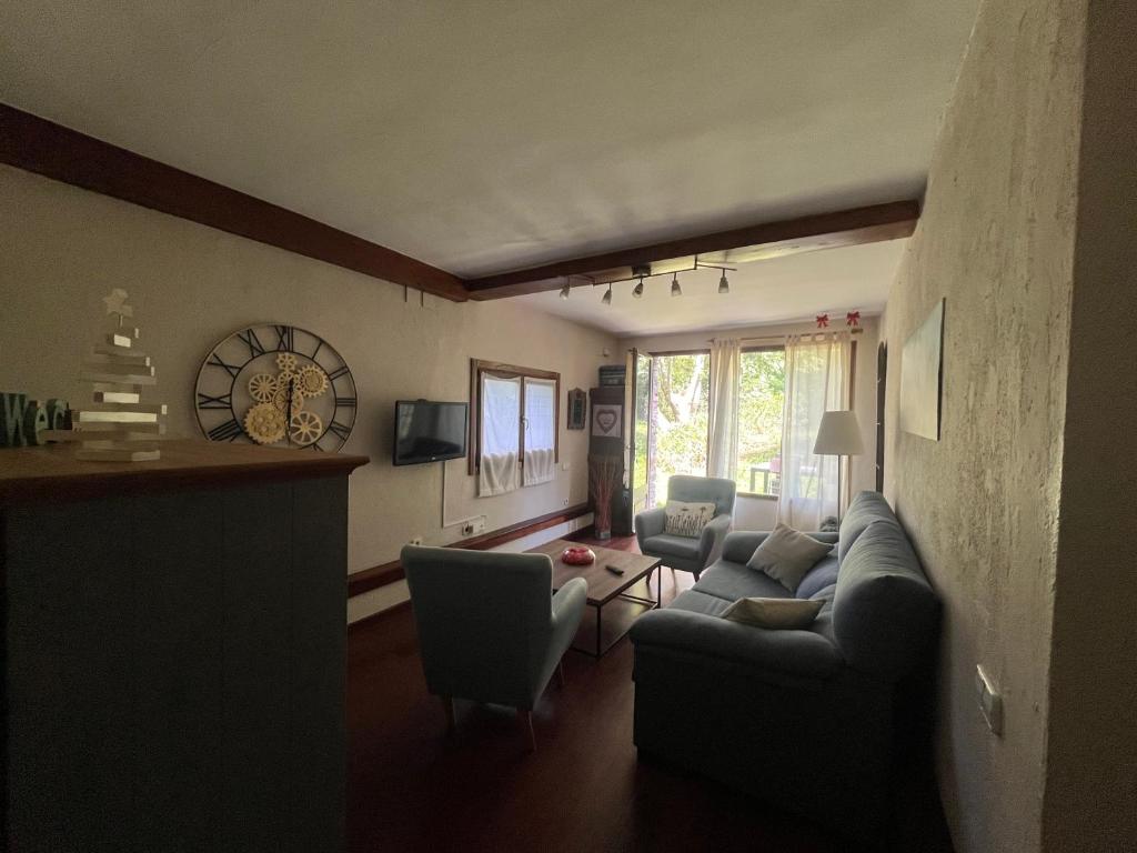 TV a/nebo společenská místnost v ubytování Apartamentos Casa Gemma