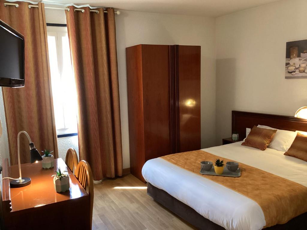 Postel nebo postele na pokoji v ubytování Hôtel Angelic