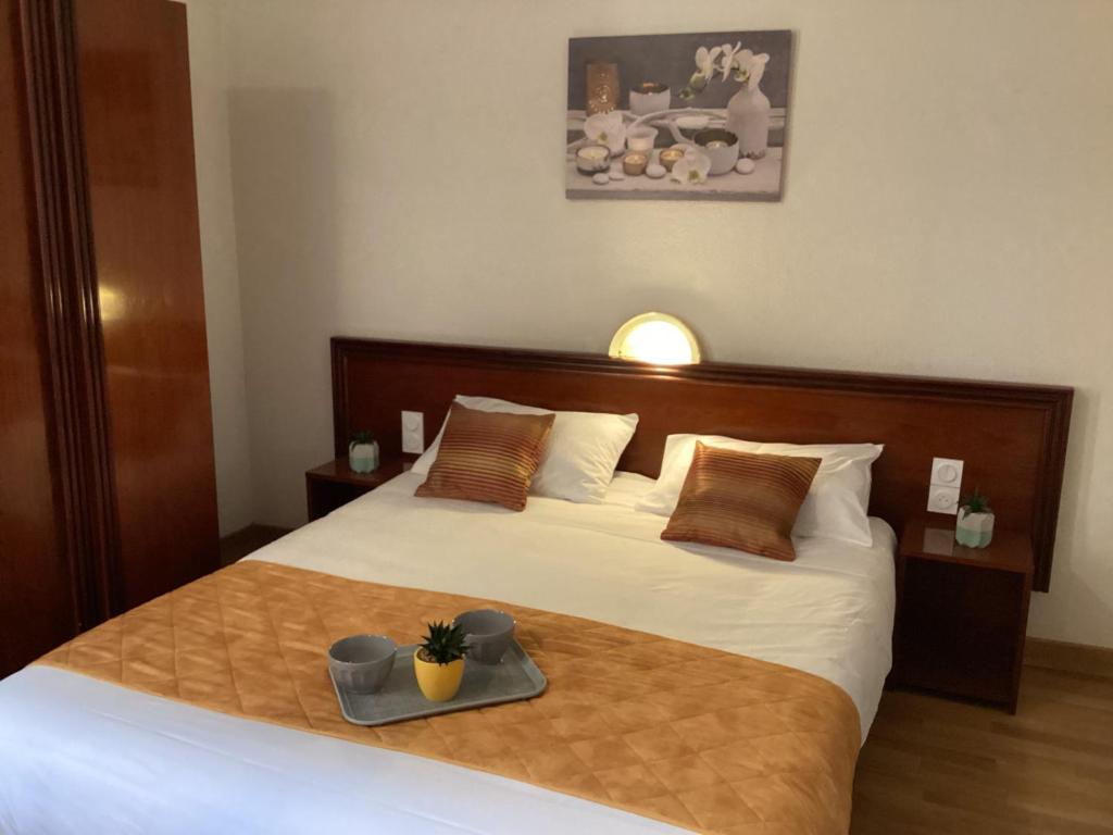 Postel nebo postele na pokoji v ubytování Hôtel Angelic