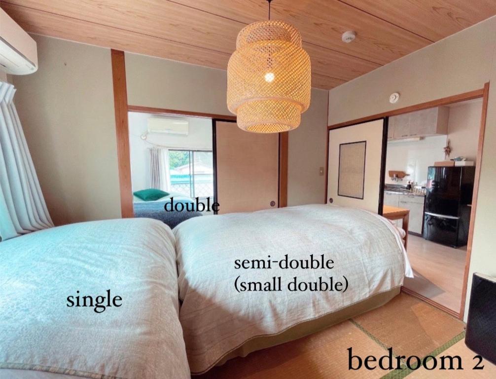 Cama o camas de una habitación en 民泊宿 i s e s h i m a 伊勢内宮前203