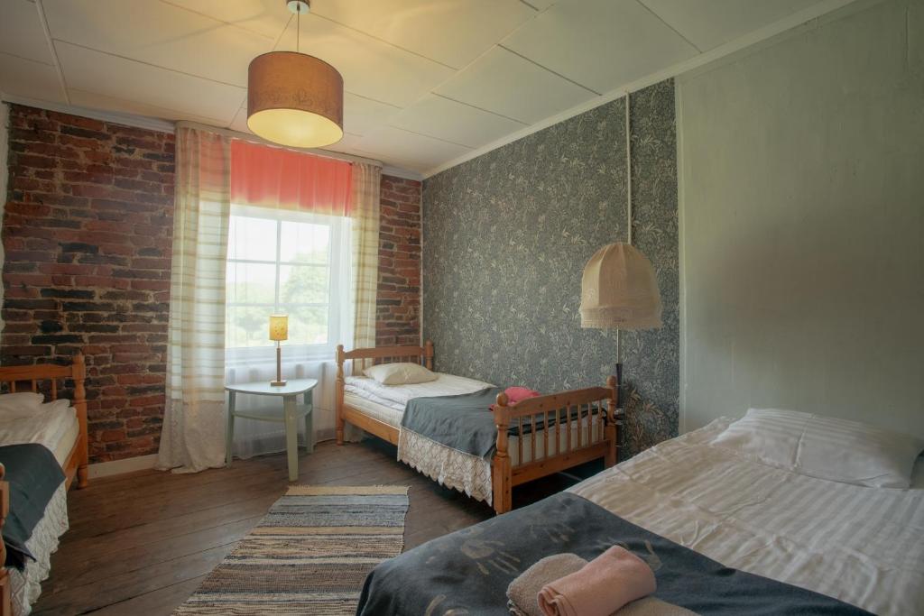 Voodi või voodid majutusasutuse Guesthouse Kadrina Mõis toas