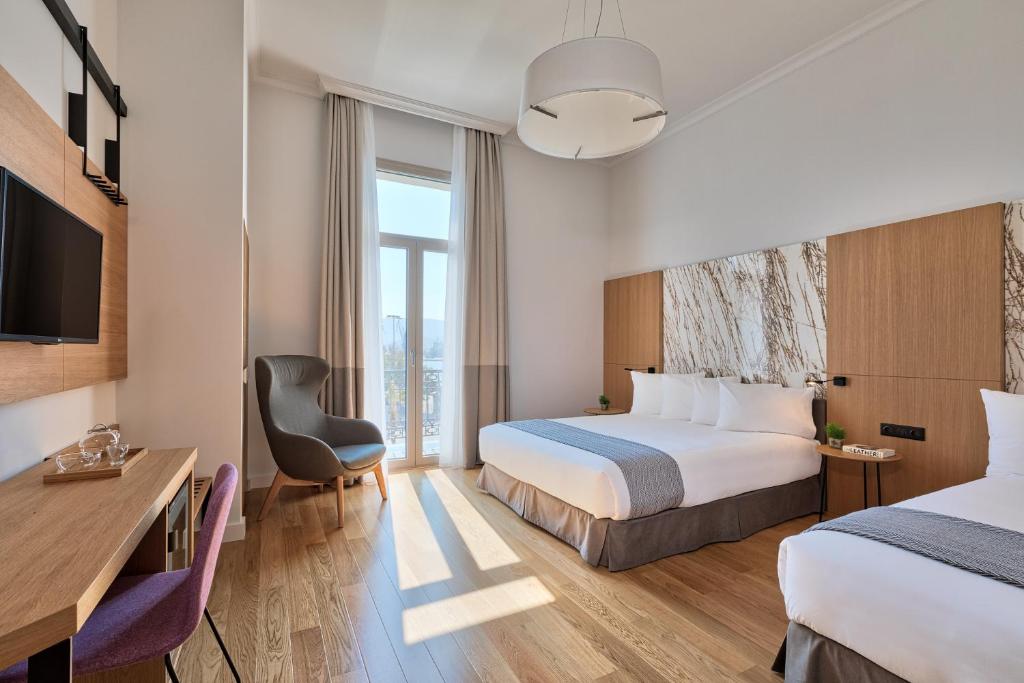 Ένα ή περισσότερα κρεβάτια σε δωμάτιο στο Aegli Hotel Volos