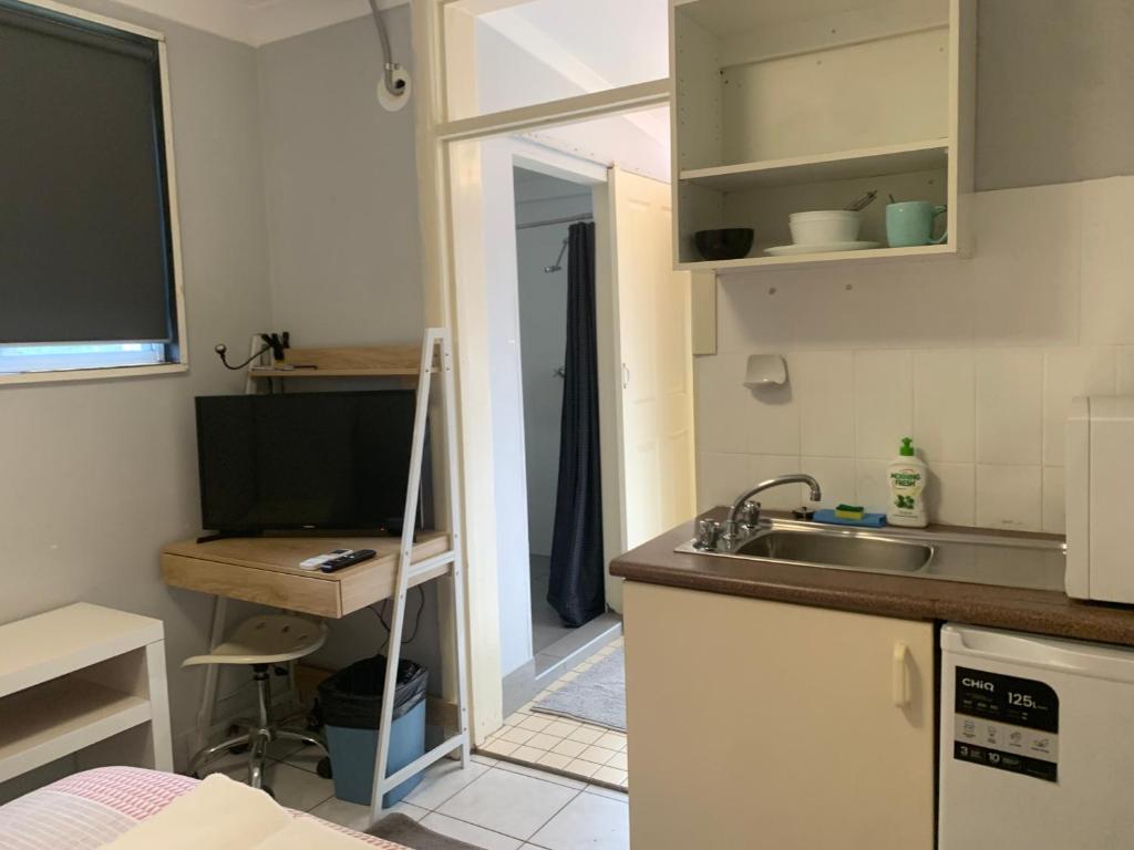 Kuchyň nebo kuchyňský kout v ubytování Manly Bunkhouse