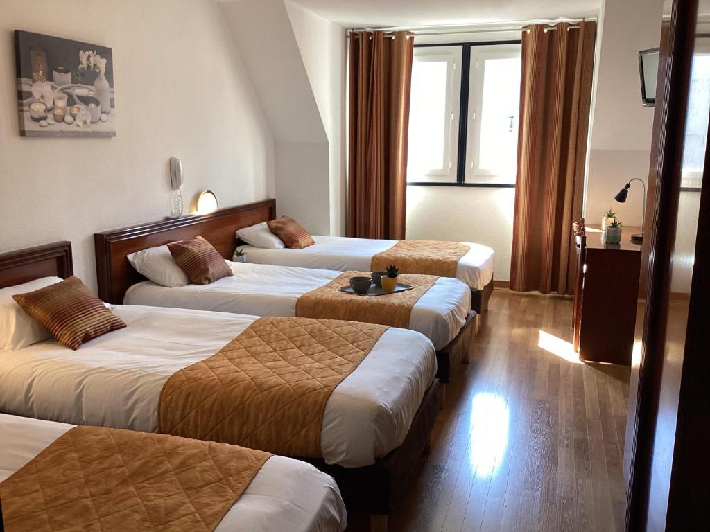 Postel nebo postele na pokoji v ubytování Hôtel Angelic