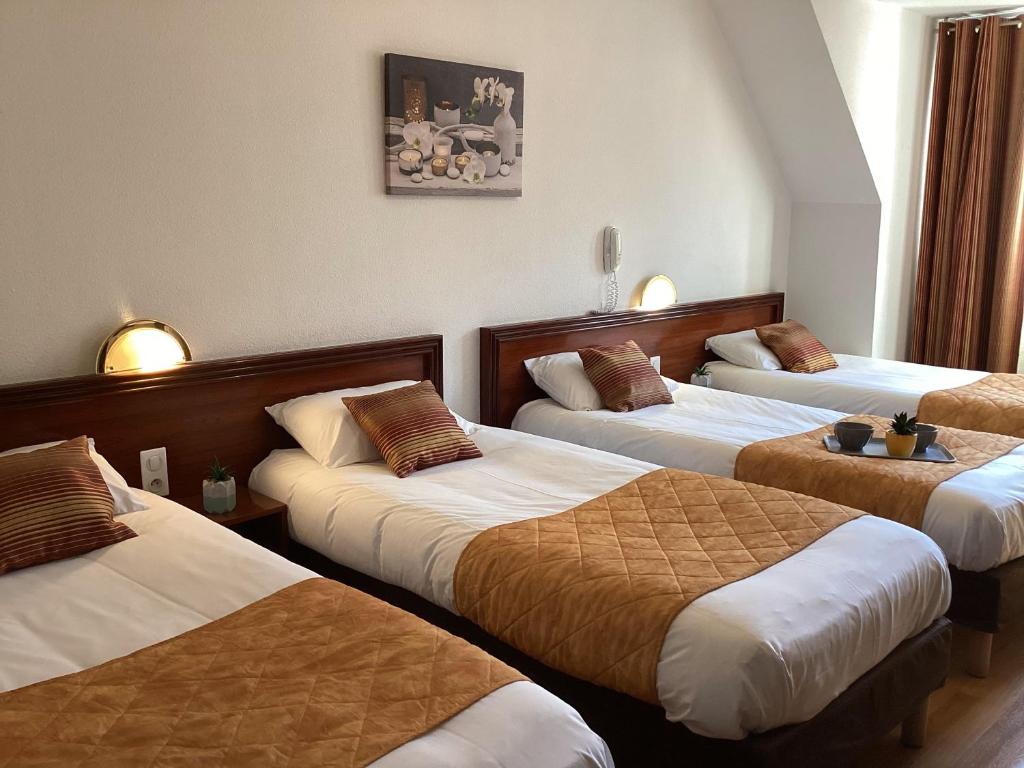 Postel nebo postele na pokoji v ubytování Hôtel Angelic