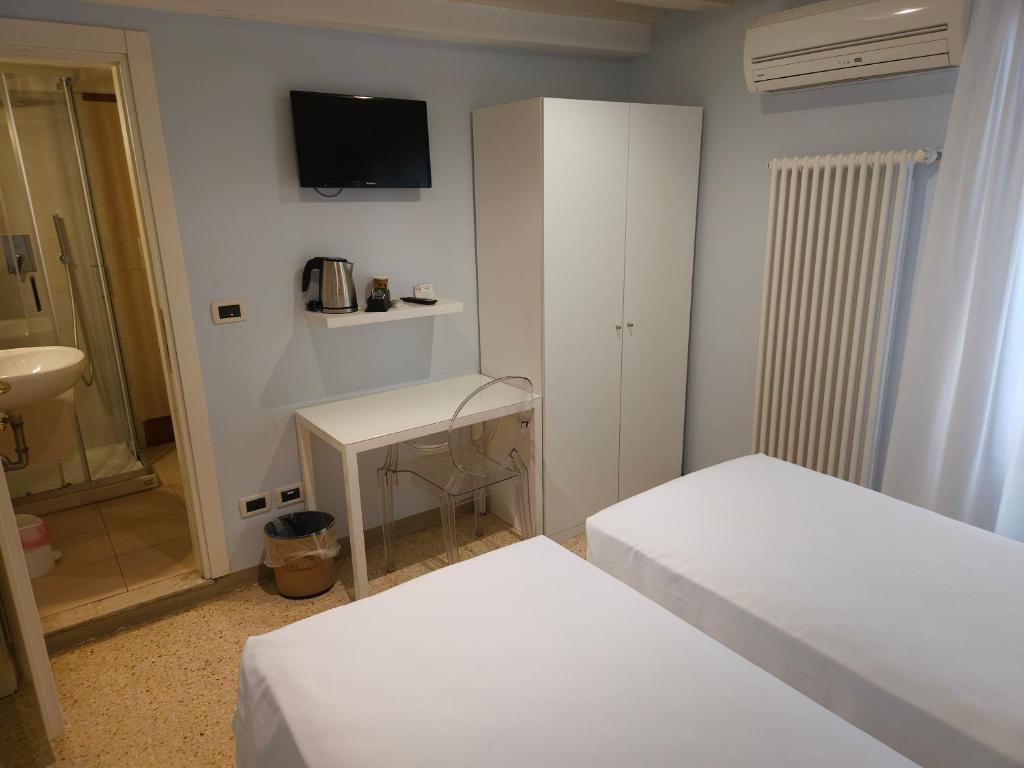 Postel nebo postele na pokoji v ubytování Hotel Adriatico