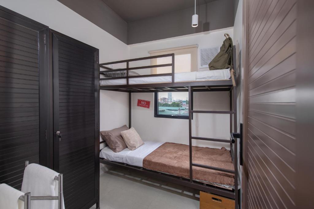 Postel nebo postele na pokoji v ubytování The Grid Co-Living Managed by HII