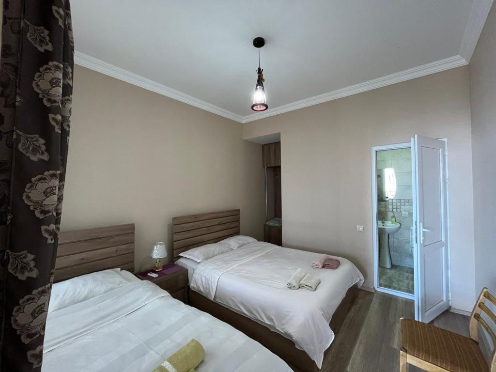 Llit o llits en una habitació de Guest House Aisi