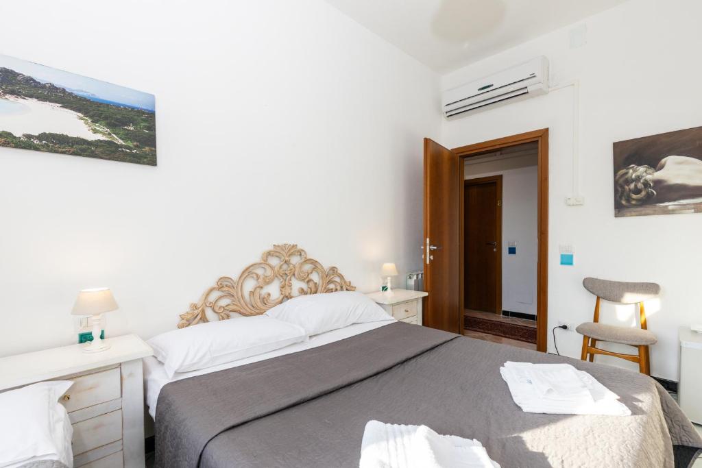 Postel nebo postele na pokoji v ubytování Helios Hotel