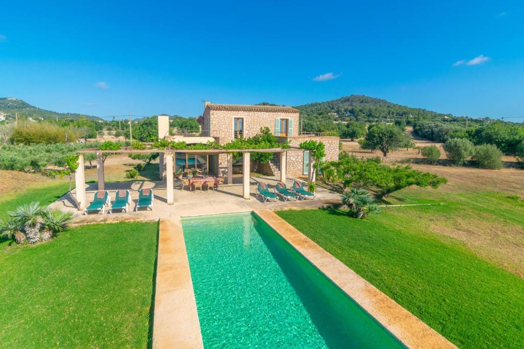 an aerial view of a villa with a swimming pool at Can Jeroni Carrio in Cala Bona