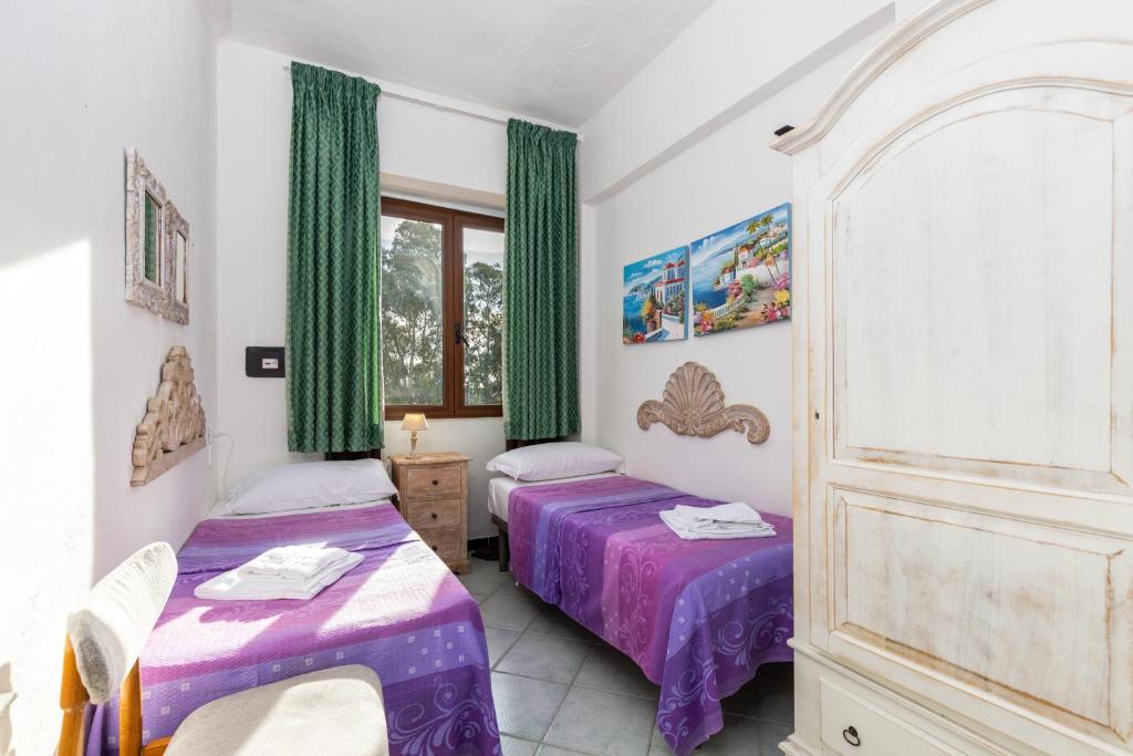 Postel nebo postele na pokoji v ubytování Helios Hotel