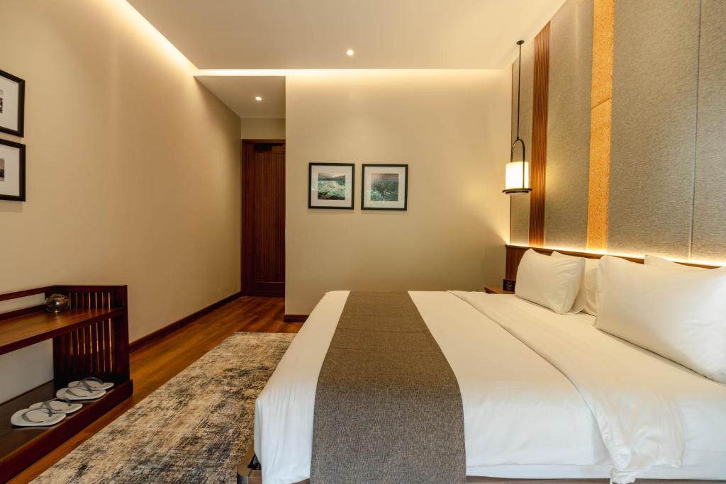 Postel nebo postele na pokoji v ubytování Plataran Puncak Residences