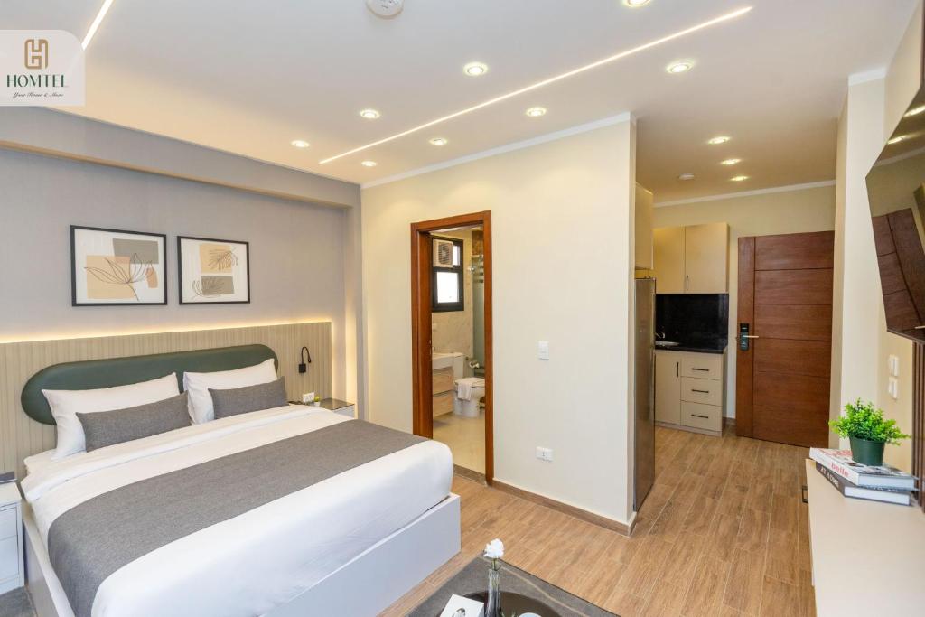 TV a/nebo společenská místnost v ubytování Homtel Residence AUC
