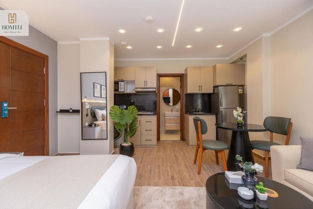 TV a/nebo společenská místnost v ubytování Homtel Residence AUC