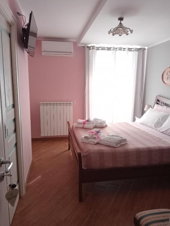 Postel nebo postele na pokoji v ubytování B&B A TAVERNA