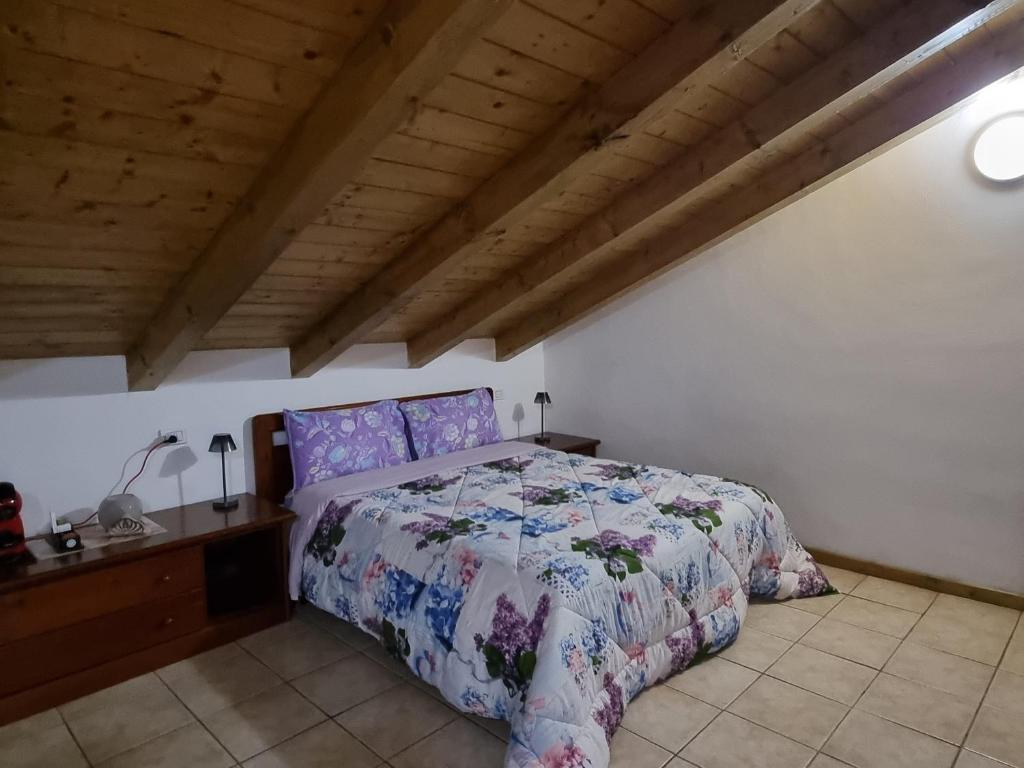 Postel nebo postele na pokoji v ubytování Camera Adamello 2