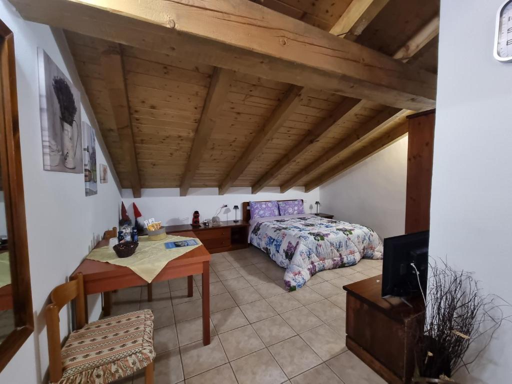 Postel nebo postele na pokoji v ubytování Camera Adamello 2