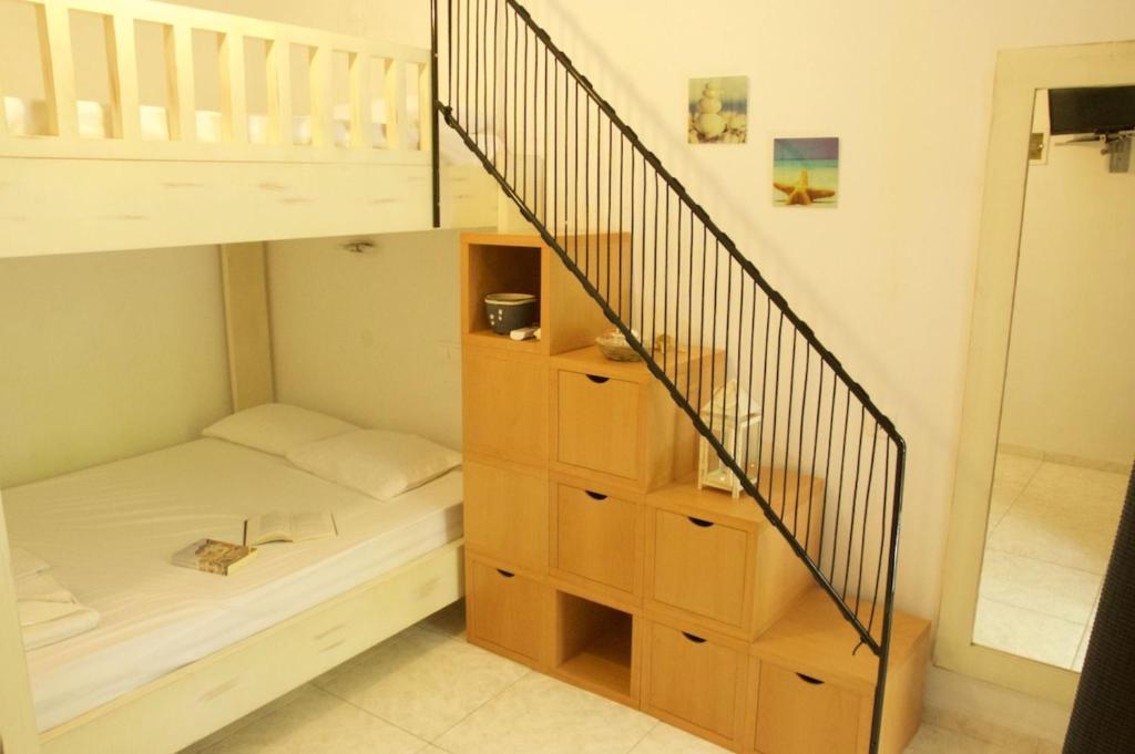 Postel nebo postele na pokoji v ubytování Mirto Apartments
