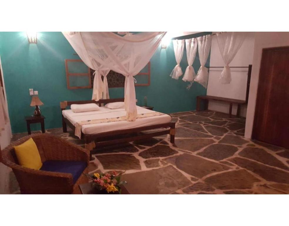 Postel nebo postele na pokoji v ubytování Eco Villas Watamu