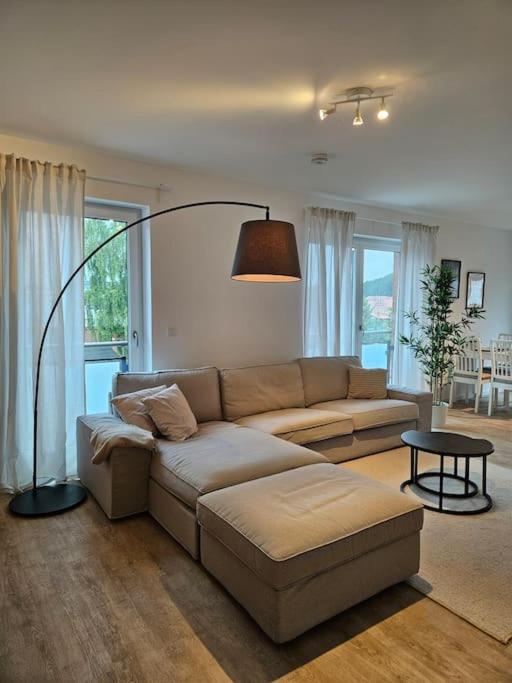 a living room with a couch and a table at Stilvoll-möbliertes Apartment in Harsefeld