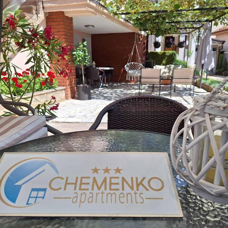 a sign sitting on top of a table at Apartments Chemenko in Konsko
