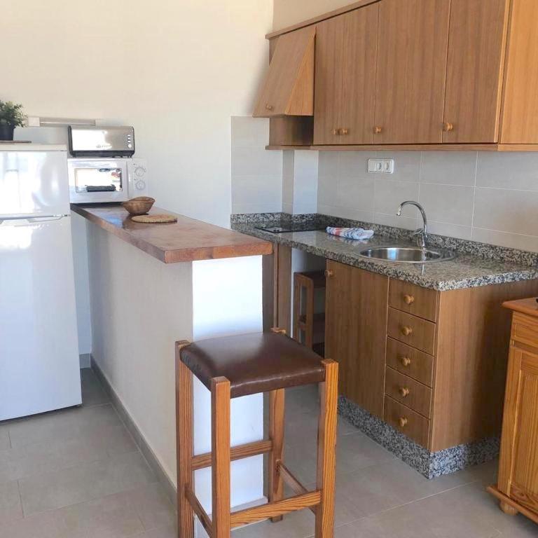 Kuchyň nebo kuchyňský kout v ubytování Apartamentos Mar i Vent Puerto de La Savina Formentera