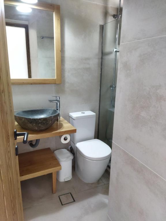 a bathroom with a sink and a toilet at Hotel Flisvos in Megalochori