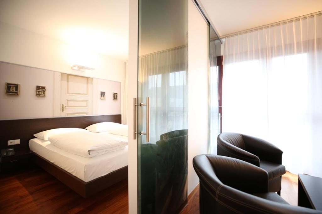 Postel nebo postele na pokoji v ubytování arte Hotel Linz