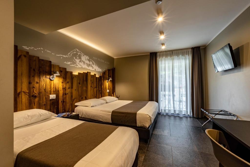 Postel nebo postele na pokoji v ubytování Monte Emilius