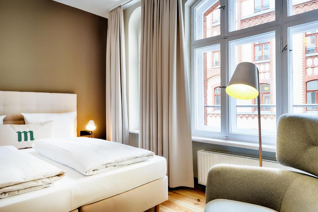 Postel nebo postele na pokoji v ubytování martas Hotel Berlin-Mitte