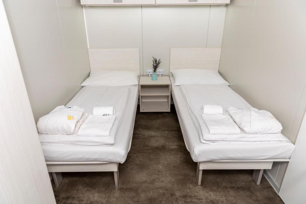 Postel nebo postele na pokoji v ubytování Vulkán Wellness Hotel & Camping