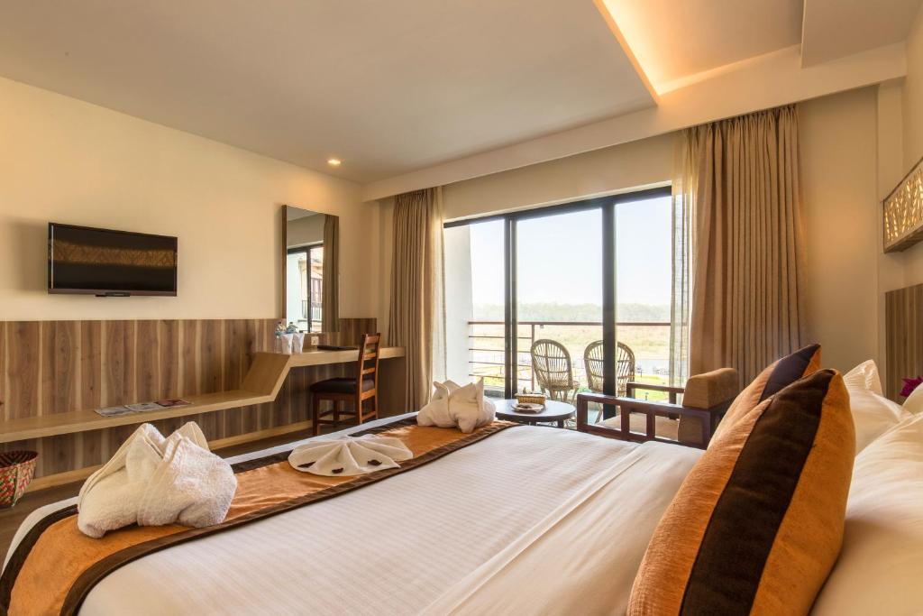 Letto o letti in una camera di Park Safari Resort, Chitwan National Park