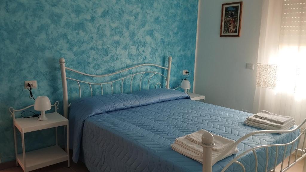 Ένα ή περισσότερα κρεβάτια σε δωμάτιο στο Sa Domo de Lillo e Arturo