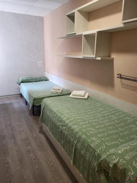 Postel nebo postele na pokoji v ubytování Albergue Residencia Larraona