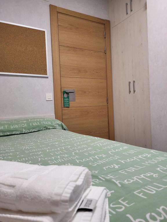 Postel nebo postele na pokoji v ubytování Albergue Residencia Larraona