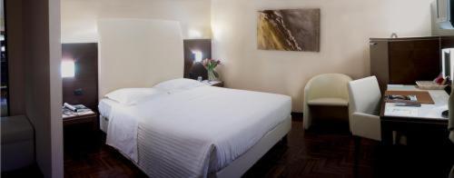 Posteľ alebo postele v izbe v ubytovaní Hotel Habitat