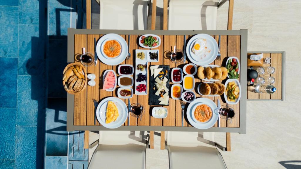 an overhead view of a table full of food at Kamer Exclusive Hotel & Suites in Çeşme